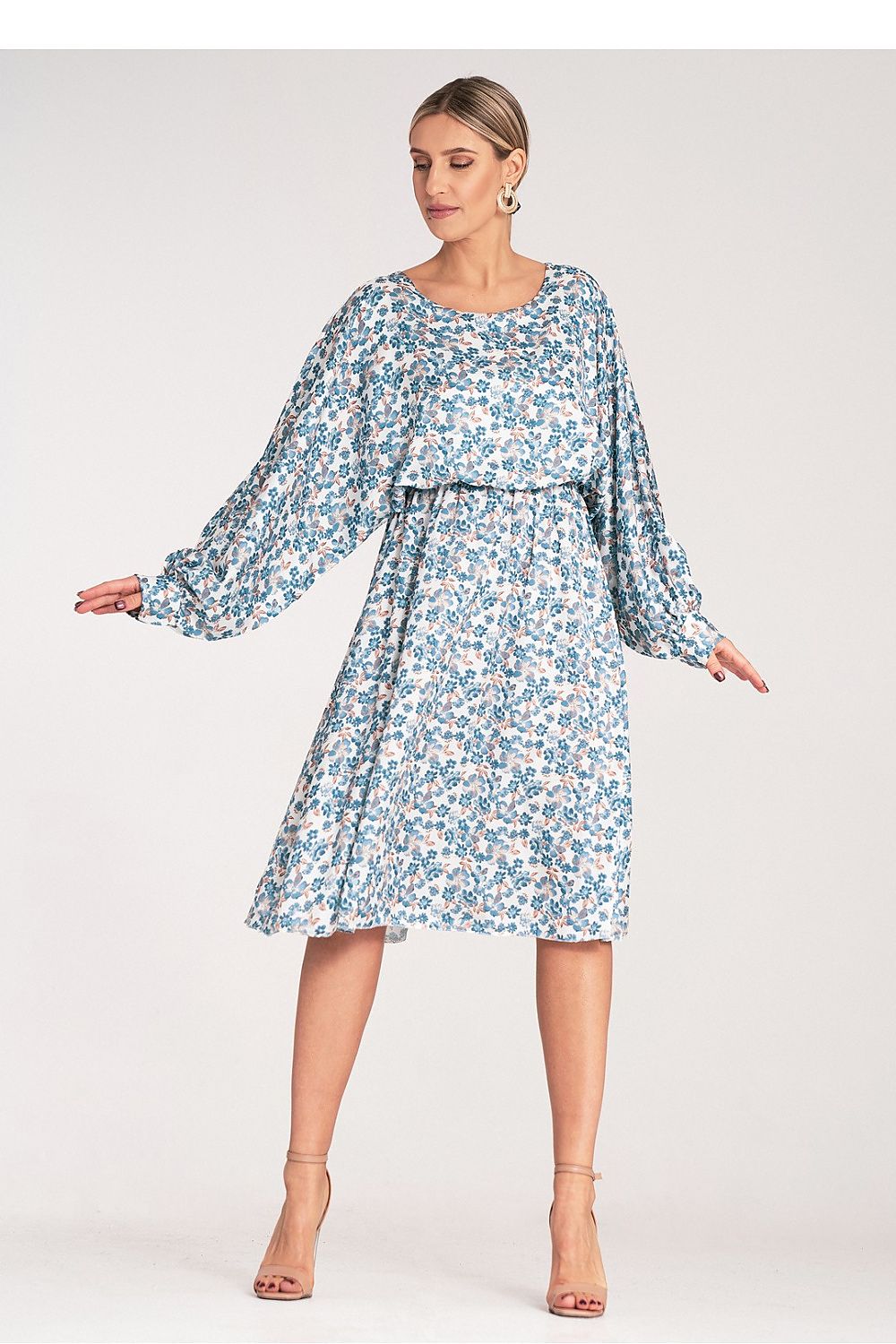 Elegant luxury floral midi dress by Figl, showcasing a kimono-style cut with loose sleeves and cuffs against a sophisticated backdrop.
