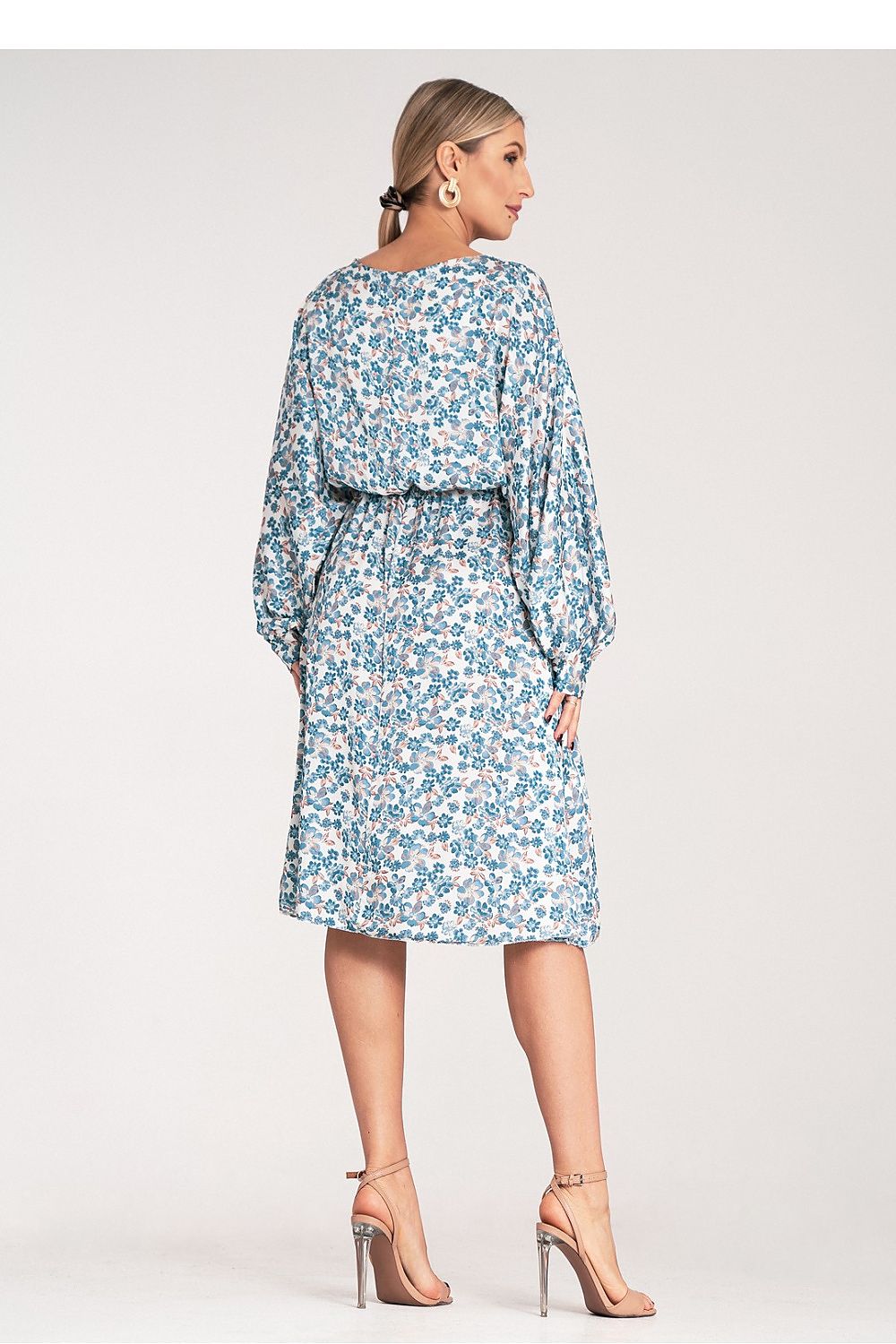 Styling options for the luxury floral midi dress by Figl, demonstrating its versatility in a chic and elegant setting.