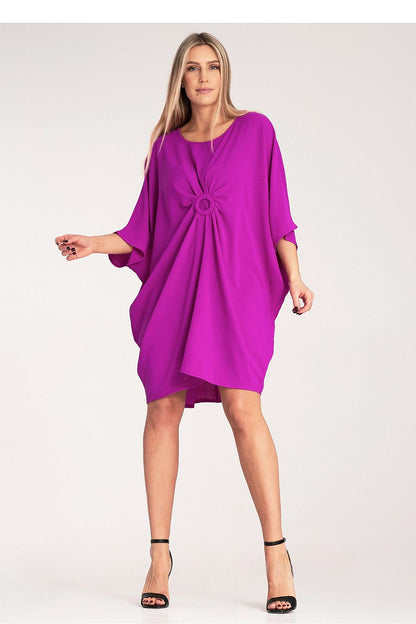 Elegant Figl loose daydress with a ruched effect and decorative ring, showcasing a sophisticated style perfect for casual and special occasions.
