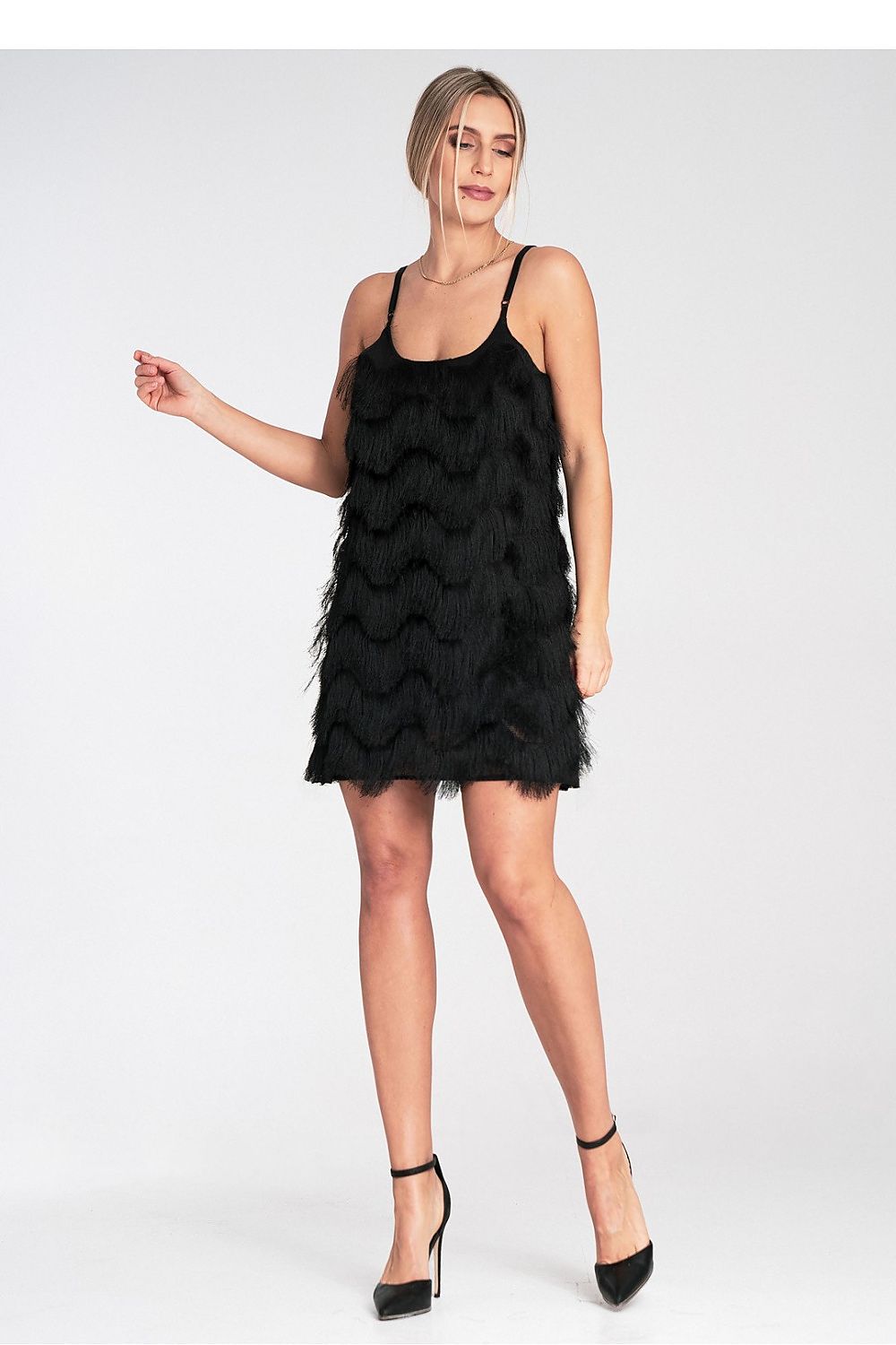 Close-up of Figl luxury maxi evening dress showcasing intricate decorative fringes, designed for the sophisticated woman looking for style and comfort.