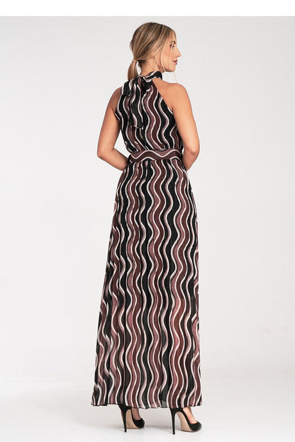 Elegant Figl Maxi Dress showcasing bare shoulders and intricate pleated design, embodying luxury and sophistication in fashion.
