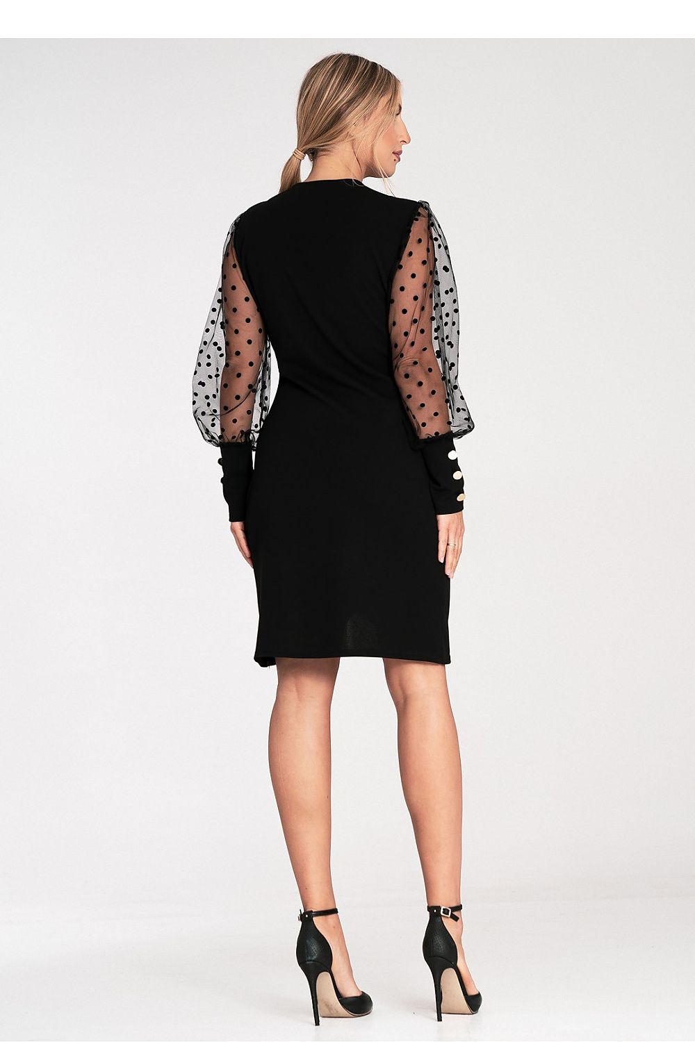 Stylish Figl evening dress modelled on a mannequin, highlighting its elegant silhouette and polka dot sleeve detail for a glamorous evening outfit.