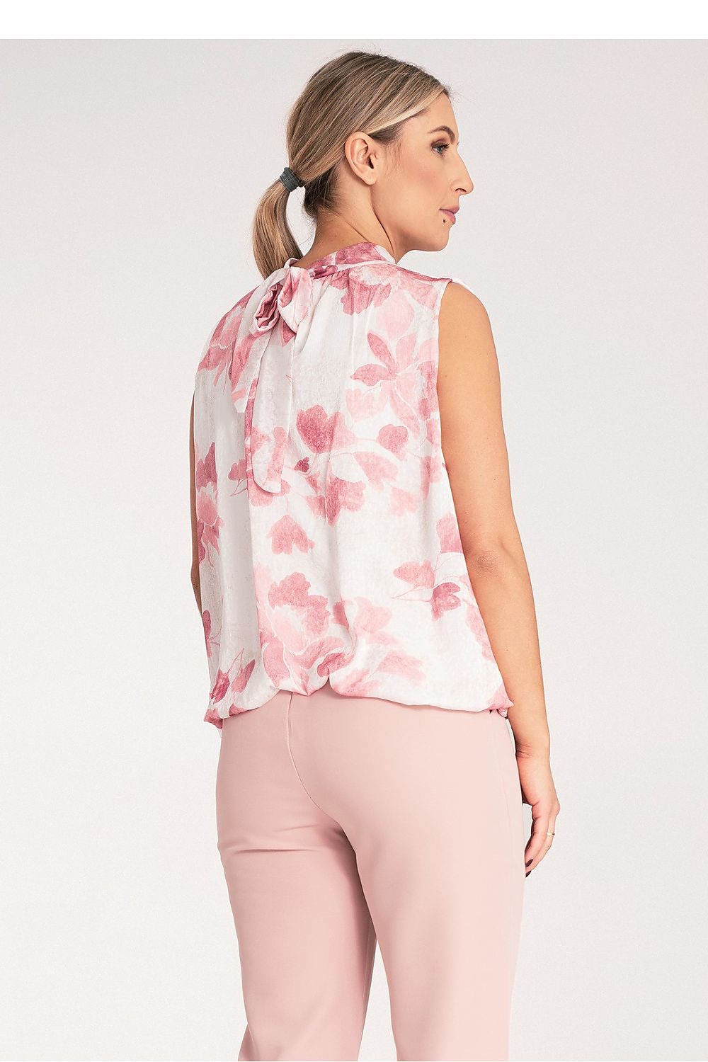 Stylish Figl sleeveless top in EU S/M, featuring a soft viscose lining and a chic back tie design, perfect for sophisticated wardrobes.