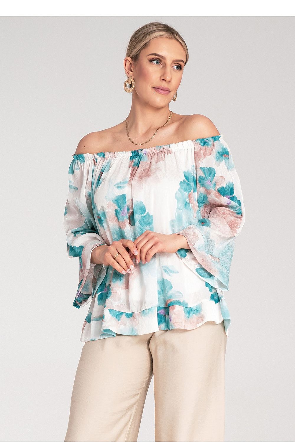 Model wearing the Figl Spanish style blouse with wide neckline and cuffed 3/4 sleeves, exemplifying stylish sophistication.