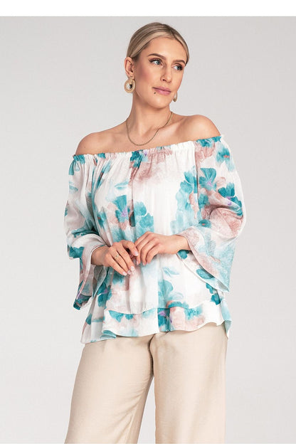 Model wearing the Figl Spanish style blouse with wide neckline and cuffed 3/4 sleeves, exemplifying stylish sophistication.