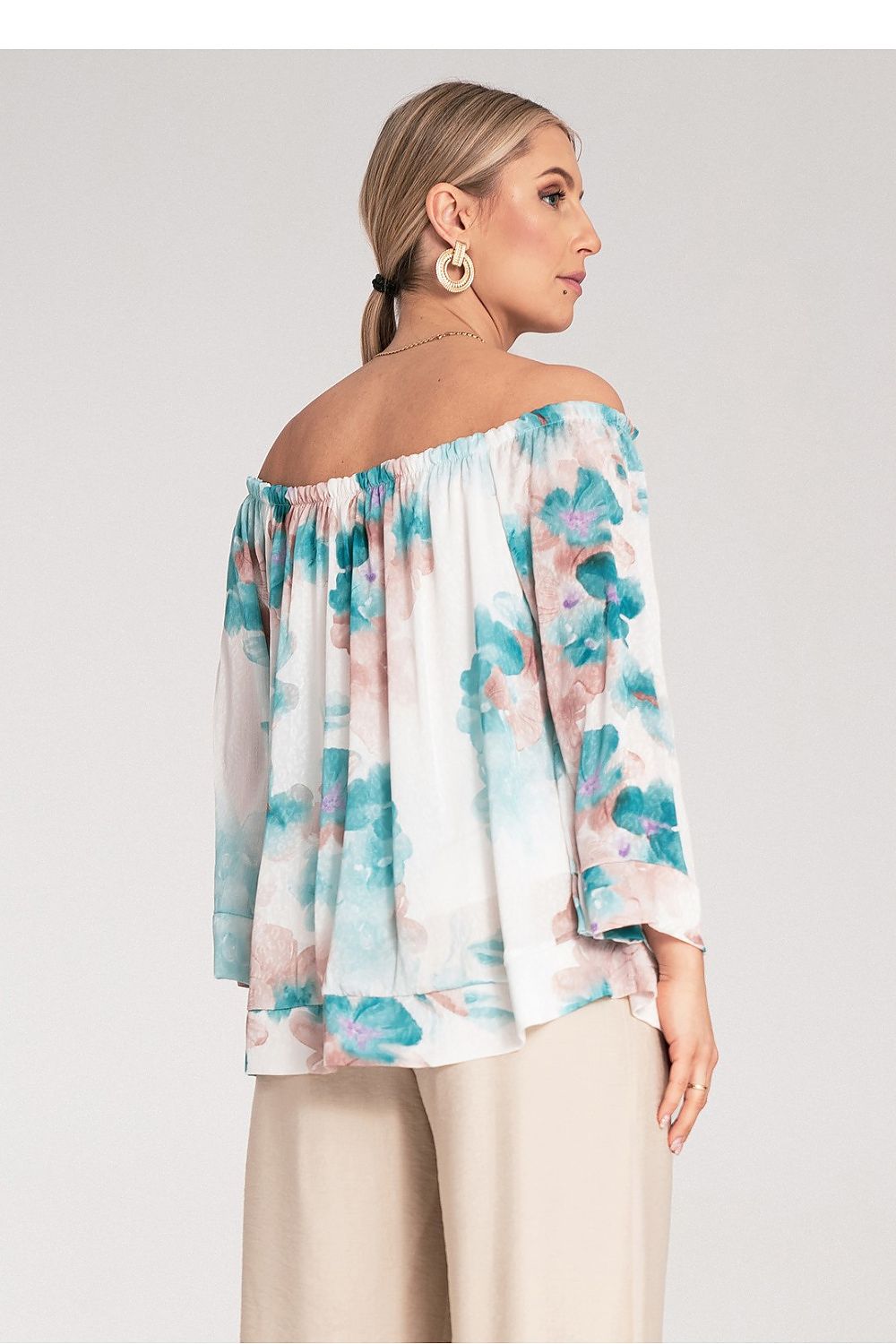 Back view of Figl Spanish fashion blouse highlighting the craftsmanship and drape of the fabric for refined comfort.