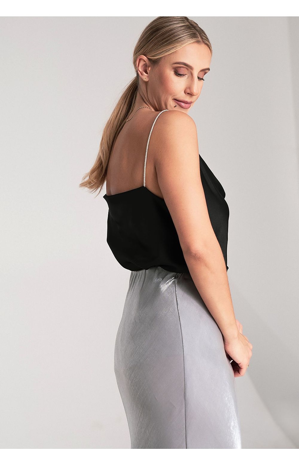Side view of Figl's satin top with flowing water neckline, highlighting the elegant silhouette and premium polyester material.