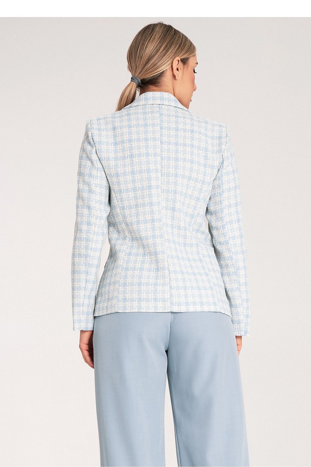 Stylish portrayal of Figl's elegant checkered jacket, showcasing its delicate jacquard fabric and luxury design elements.