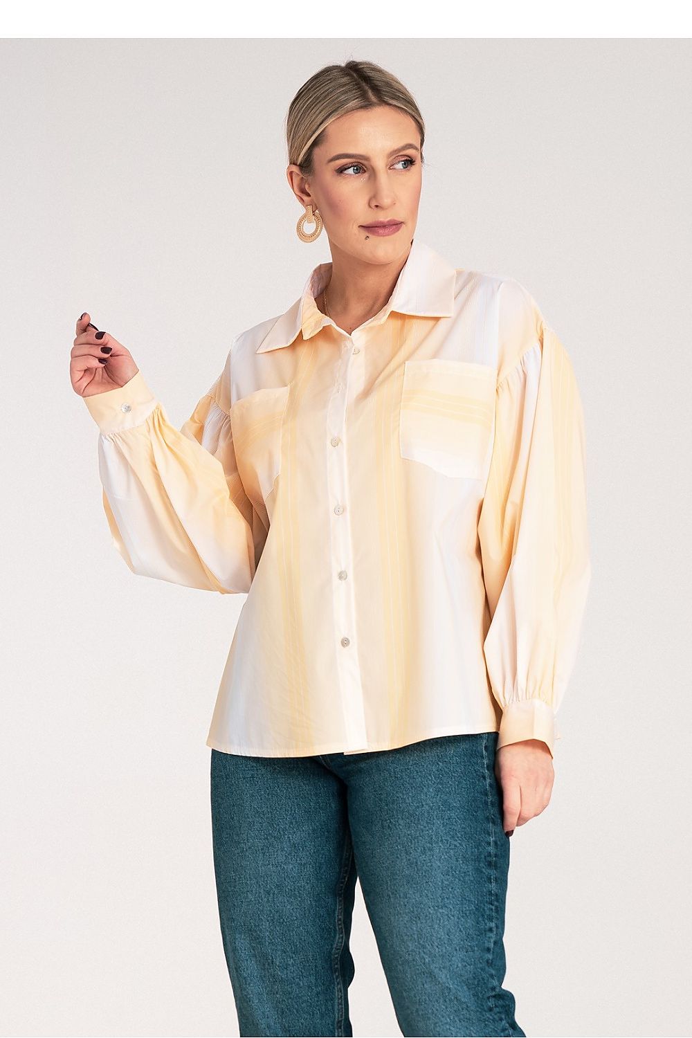 Stylish Figl Women's Long Sleeve Shirt elegantly tied at the bottom, highlighting its fashionable and voluminous sleeve design.