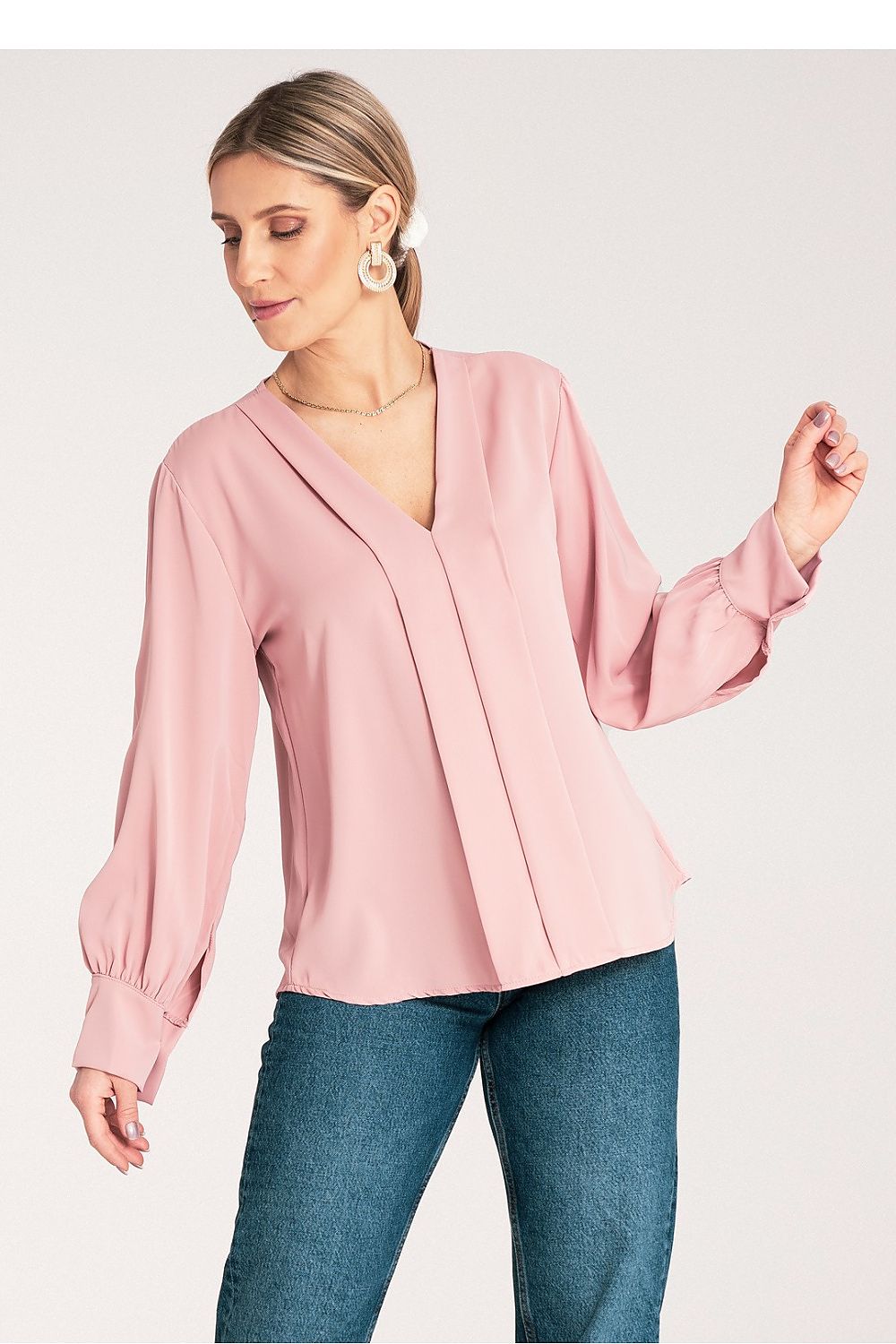 Figl's luxurious long sleeve satin blouse, showcasing exquisite stitching details and button-fastened cuffs.