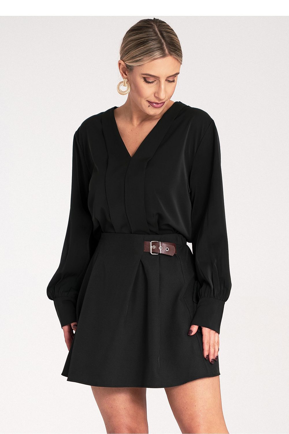 Close-up of the elegant stitching on the V-neckline of the satin blouse by Figl, highlighting craftsmanship and luxury.