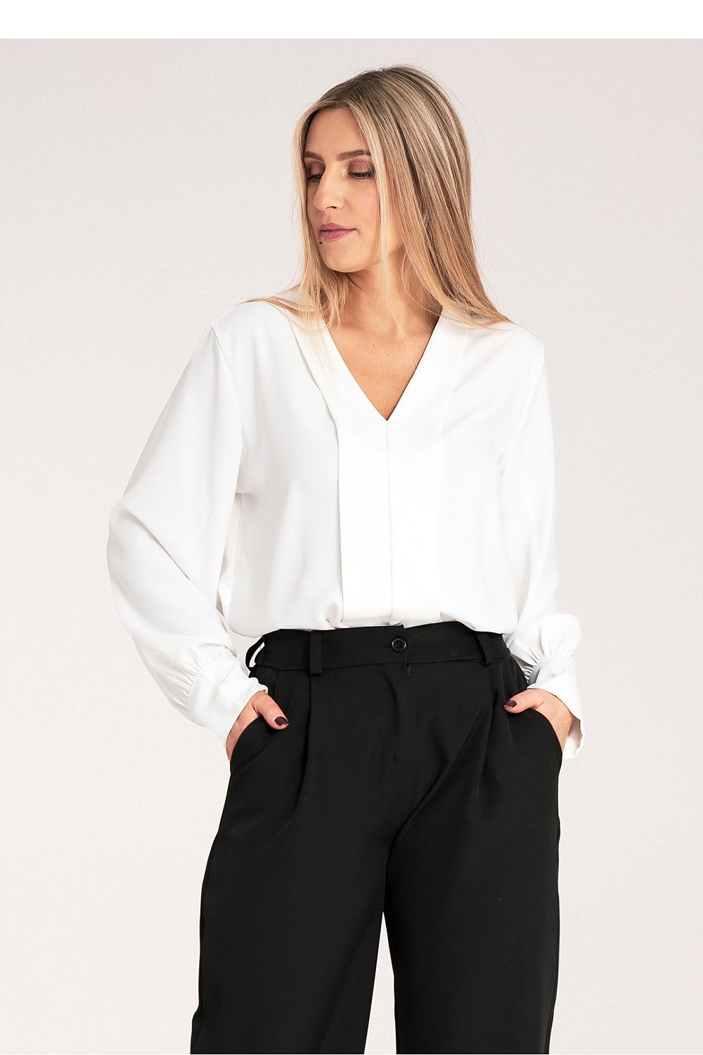 Detailed view of buttoned cuffs on a luxury satin blouse by Figl, perfect for sophisticated outfits.