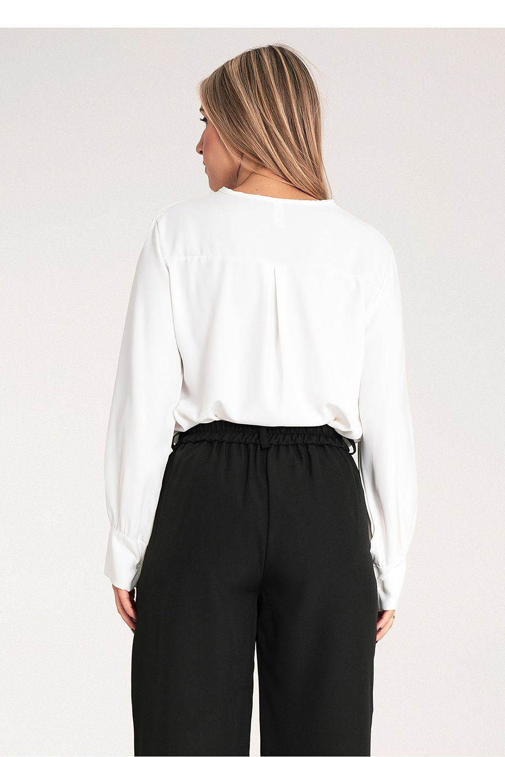 Flat lay of the high-quality satin blouse by Figl, styled with accessories for an upscale fashion look.