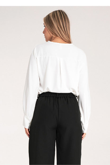 Flat lay of the high-quality satin blouse by Figl, styled with accessories for an upscale fashion look.