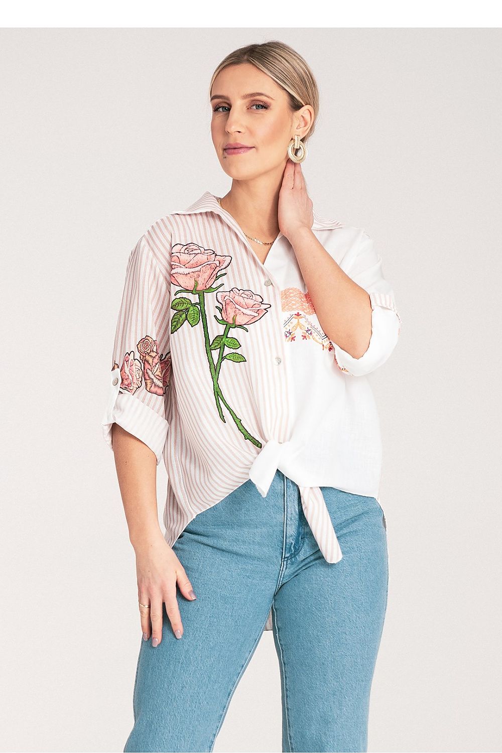 Detail view of the Figl Women's shirt showcasing its exquisite floral embroidery and classic collar design, embodying sophistication.