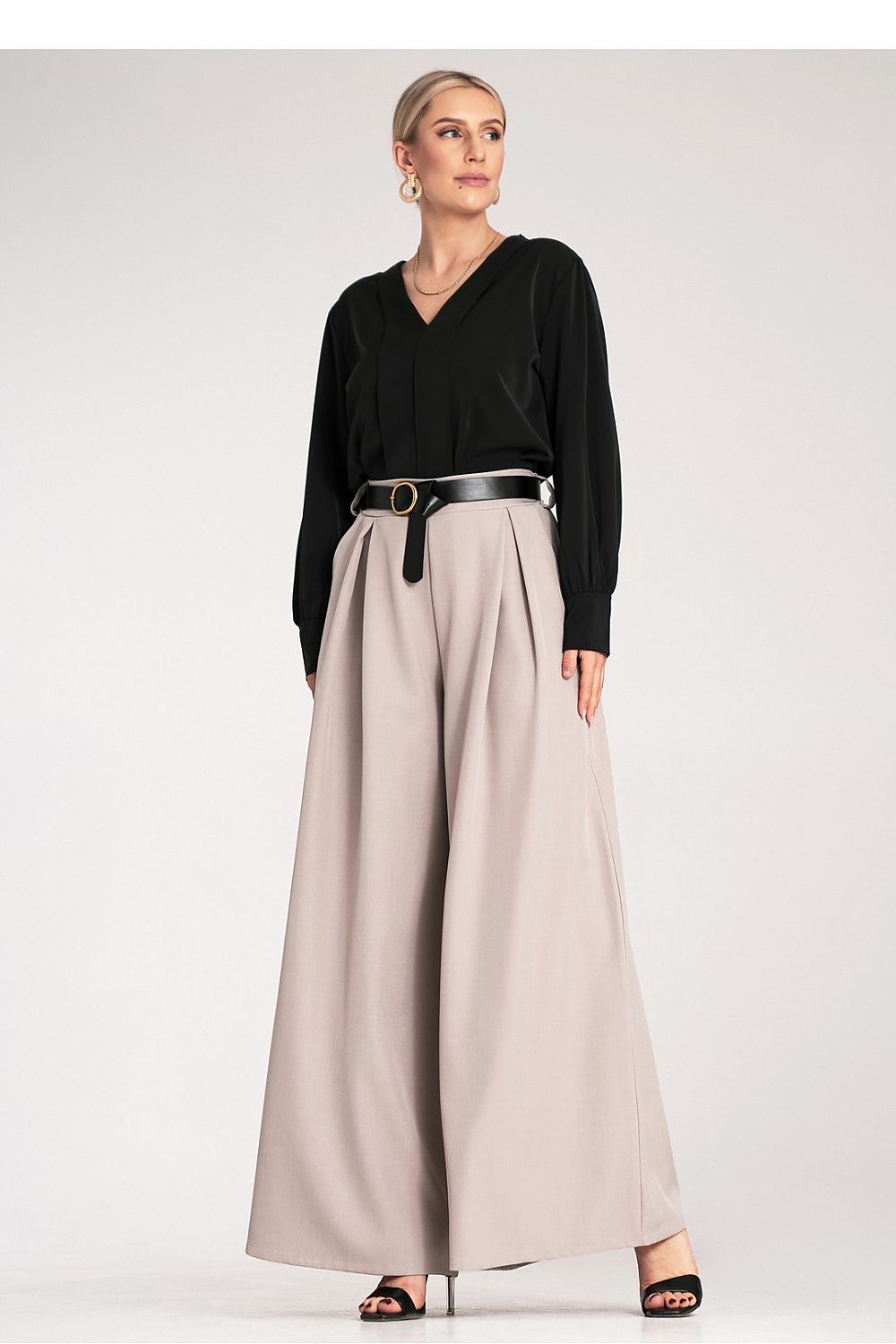Stunning palazzo trousers in EU S/M size by Figl, showcasing a modern silhouette and crafted from lightweight material for elegant movement.