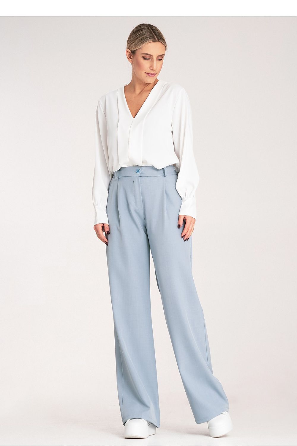 Figl Women's elegant high-waisted trousers displayed on a mannequin, highlighting their stylish loose fit and belt loops for versatile outfit options.