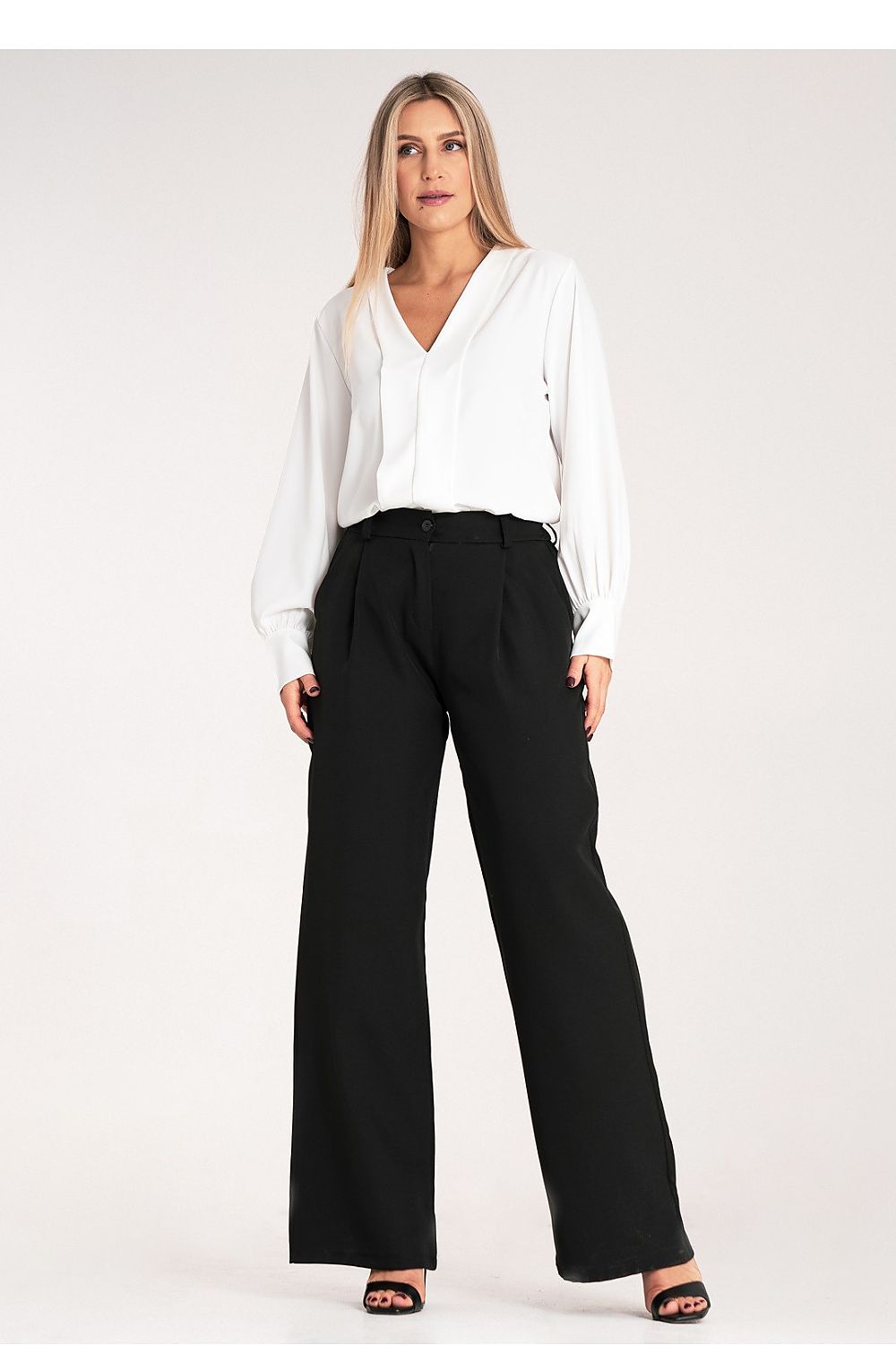 Flat lay of Figl Women's loose fit high-waisted trousers, demonstrating their elegant design and quality fabric suitable for upscale fashion.