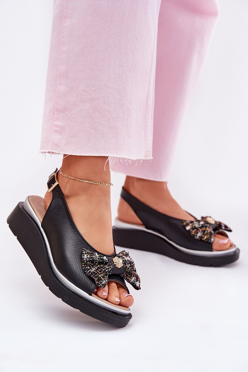 Close-up view of Step in style's beautifully crafted Women's Wedge Sandals, featuring a comfortable fit, exquisite natural leather, and stylish bow detail, perfect for completing any summer wardrobe.