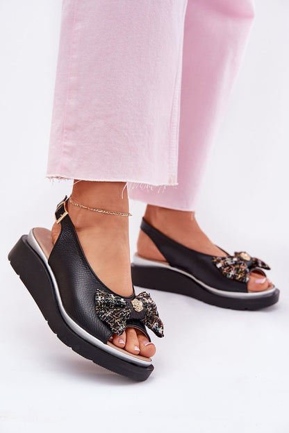 Close-up view of Step in style's beautifully crafted Women's Wedge Sandals, featuring a comfortable fit, exquisite natural leather, and stylish bow detail, perfect for completing any summer wardrobe.