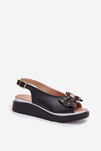 Elegant women's wedge sandals in natural leather by Step in Style, featuring an adjustable buckle and stylish bow detail, perfect for summer outings.
