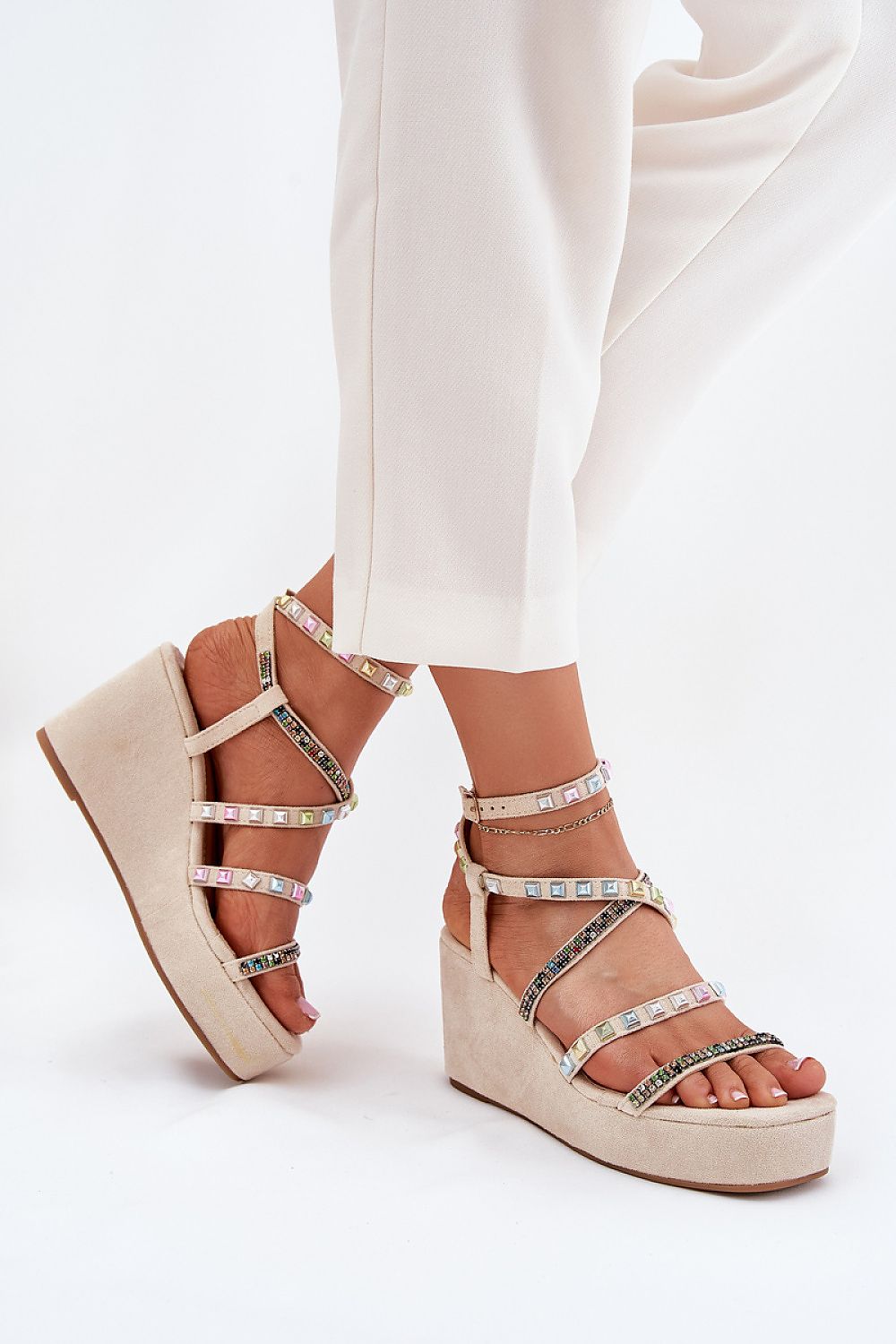 Close-up of Step in Style luxury women's wedge sandals, crafted from eco-suede with elegant embellishments for a chic summer look.