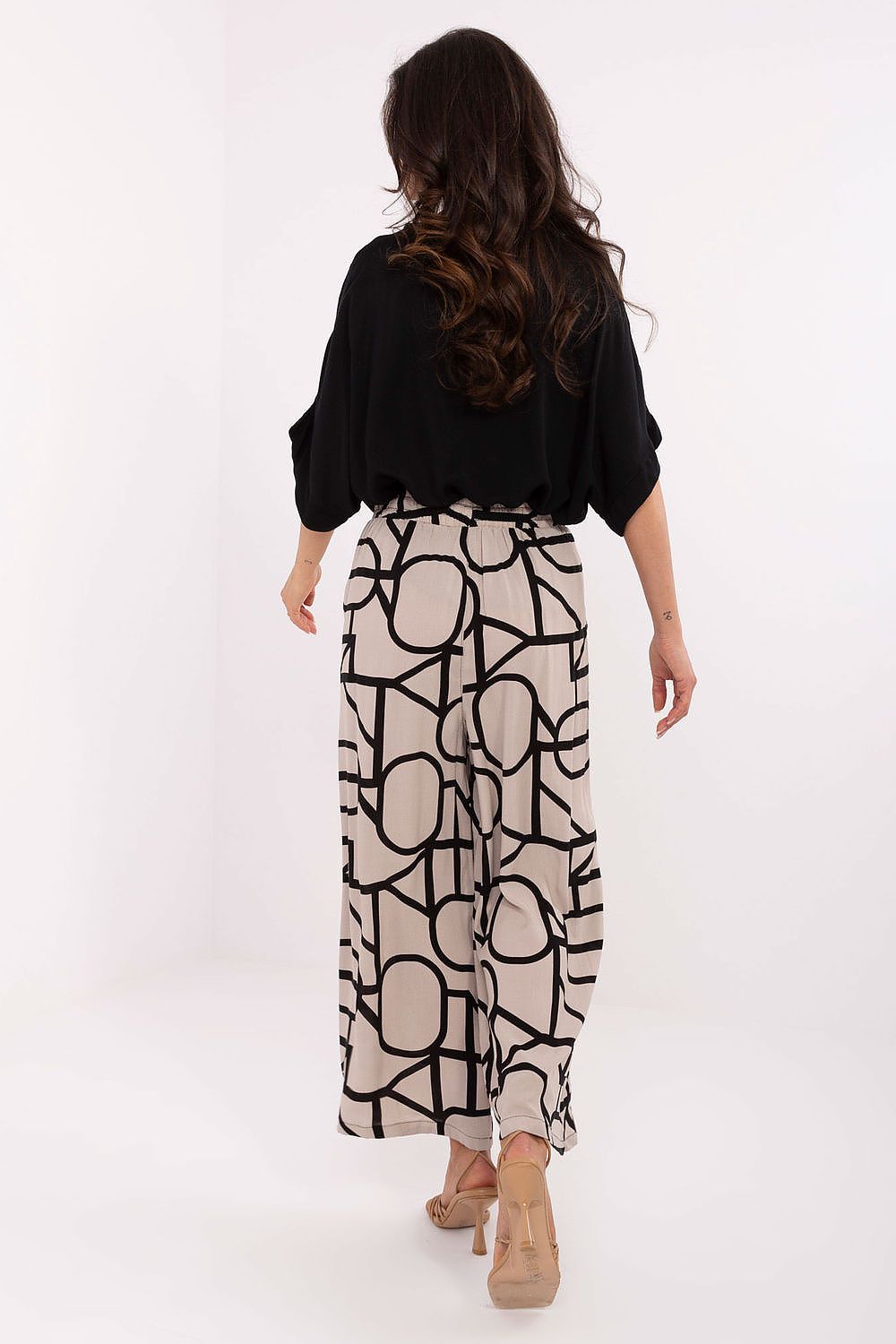 Detailed view of vivid print on Sublevel women's high-waist trousers, showcasing eco-conscious fashion and comfort.