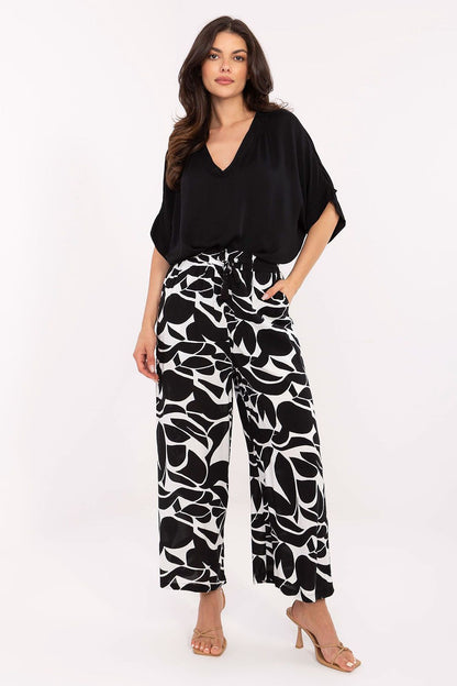 Elegant Sublevel Women’s High-Waist Trousers made from eco-friendly viscose, featuring a casual design with a high waist and decorative print.