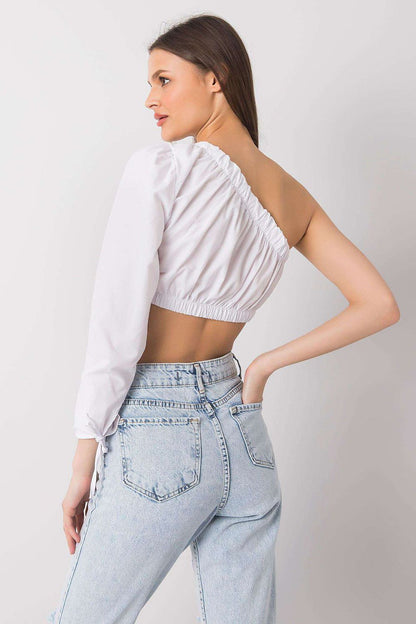 Trendy Rue Paris blouse in luxurious cotton, highlighting a modern asymmetrical neckline and feminine silhouette for everyday elegance.