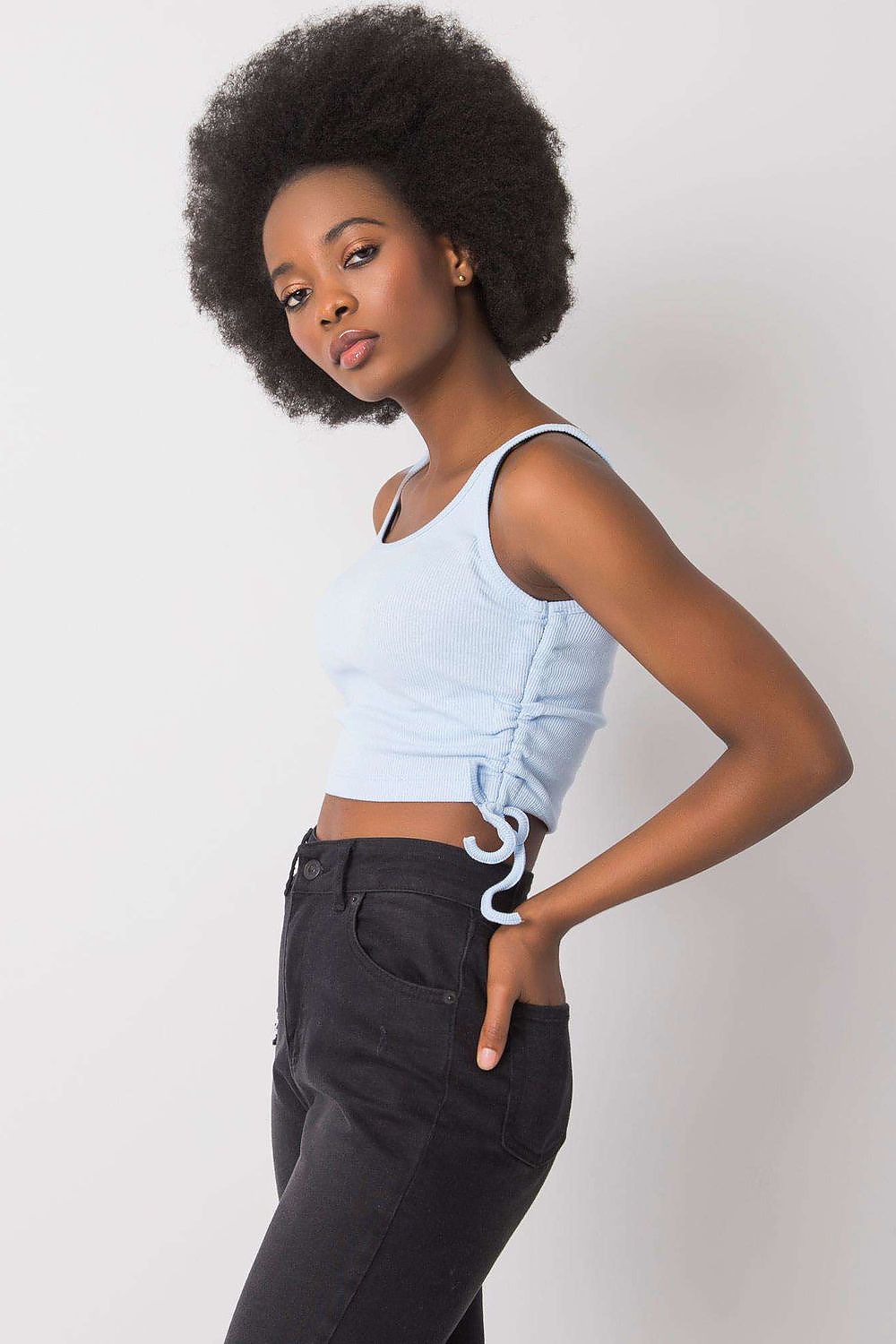 Versatile and fashionable ribbed cotton crop top by Rue Paris, ideal for high-waisted skirts and summer outings.