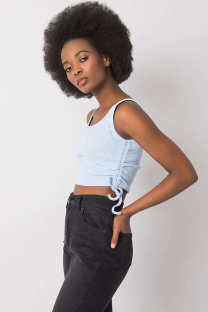 Versatile and fashionable ribbed cotton crop top by Rue Paris, ideal for high-waisted skirts and summer outings.