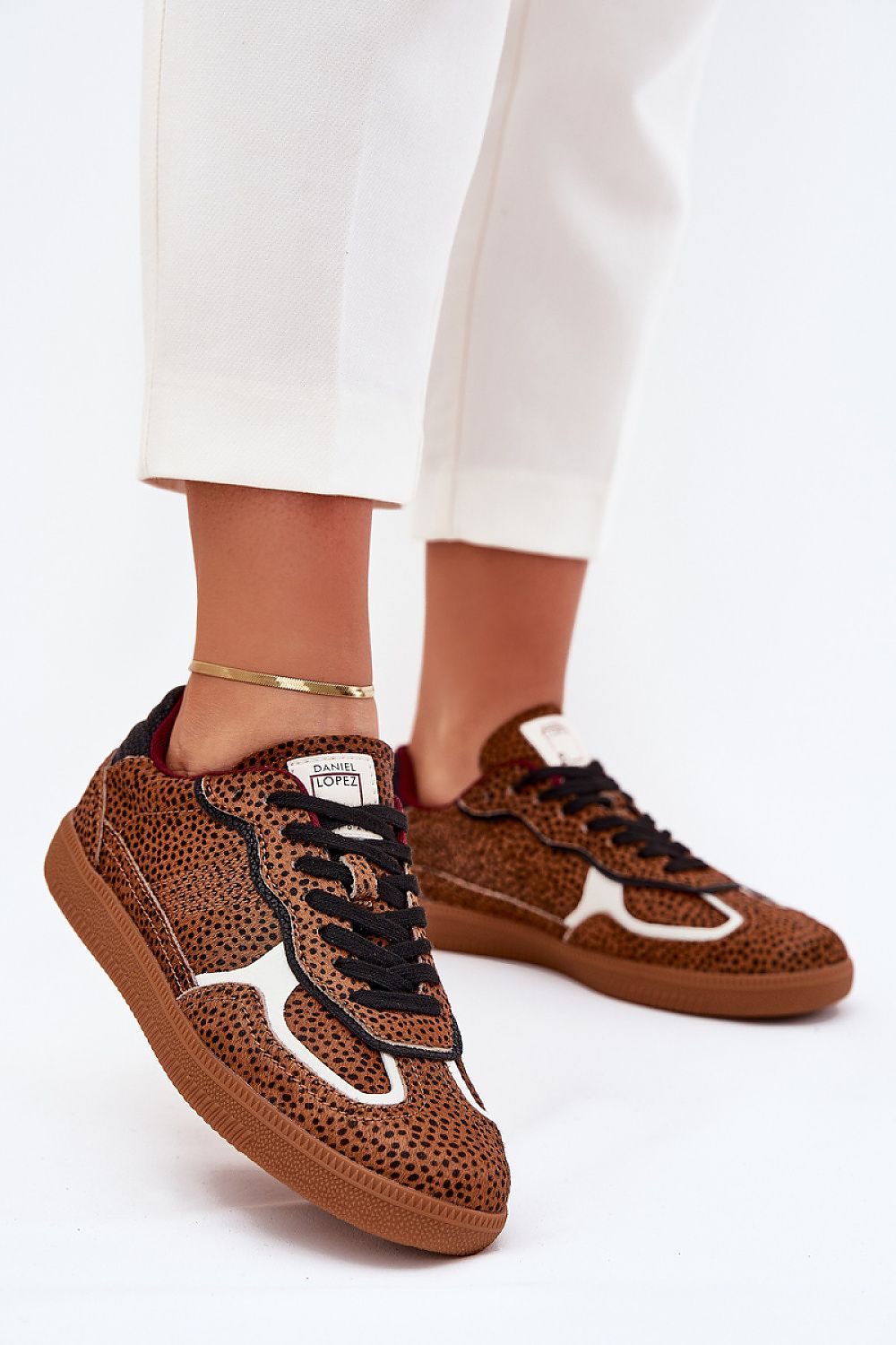 Stylish designer sport shoes by Step in Style, showcasing a luxurious combination of suede leather and vibrant animal prints for a contemporary look.