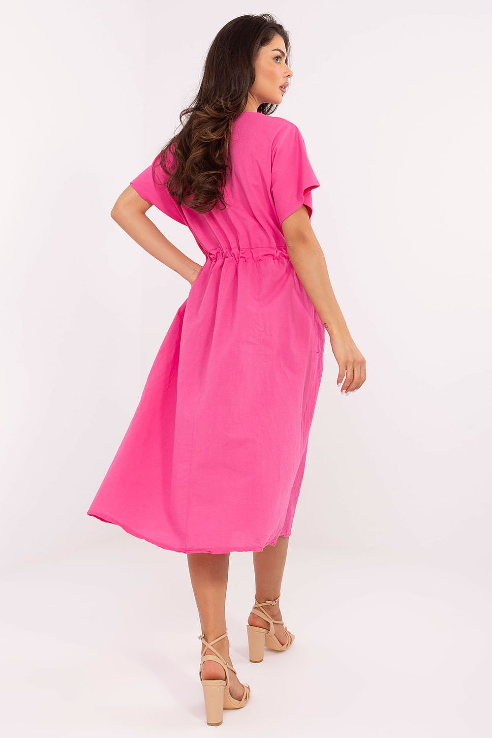 Och Bella luxury midi cotton summer dress with flared cut, showcasing elegant tie waist and slip-in pockets on a stylish backdrop.