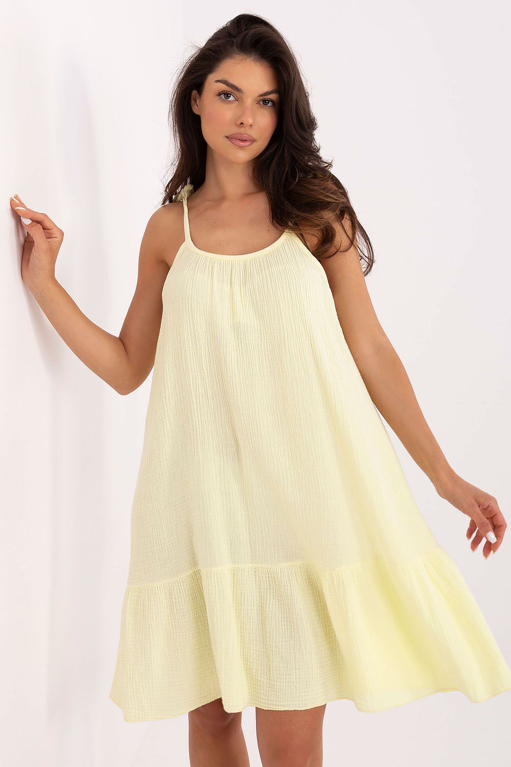 Elegantly styled Och Bella women’s daydress made from soft muslin cotton, featuring a chic flared silhouette and charming ruffles, ideal for warm weather wear.