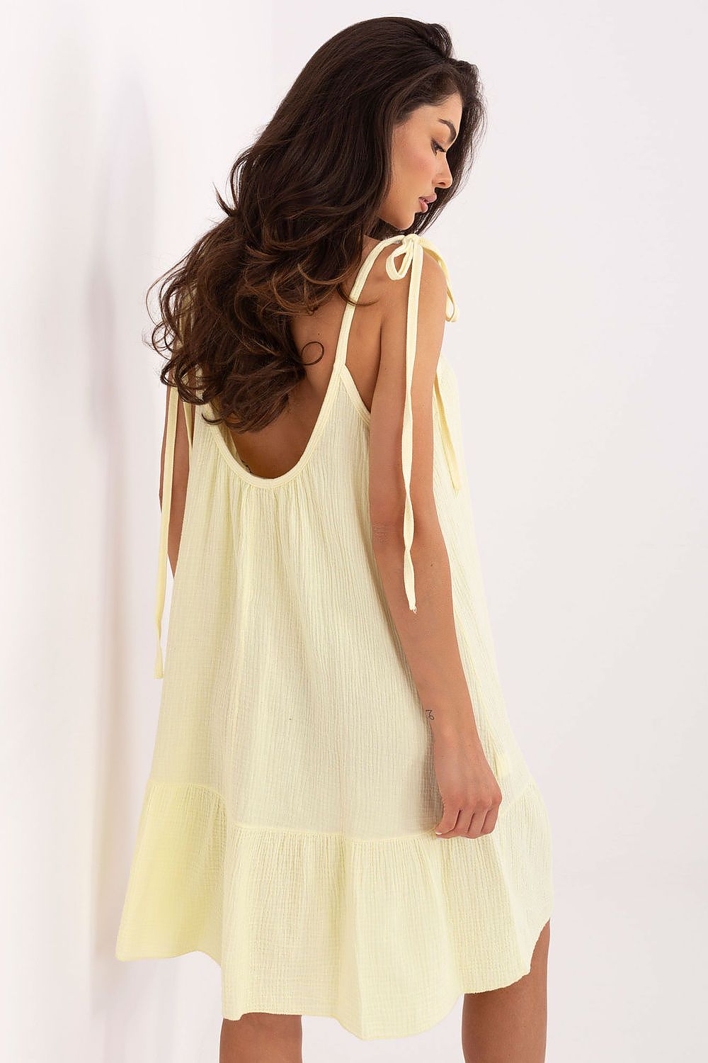 Stylish Och Bella flared daydress for women, crafted from breathable cotton, tailored with tied straps and a playful ruffled hem, making it a perfect choice for summer adventures.