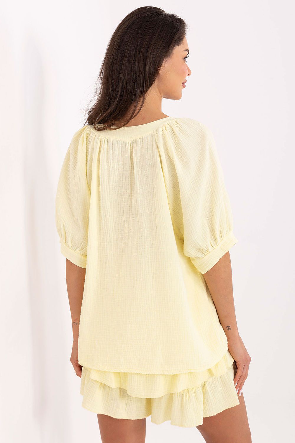 Och Bella summer ensemble featuring a relaxed fit muslin shirt paired with ruffled shorts, exuding a minimalist charm.