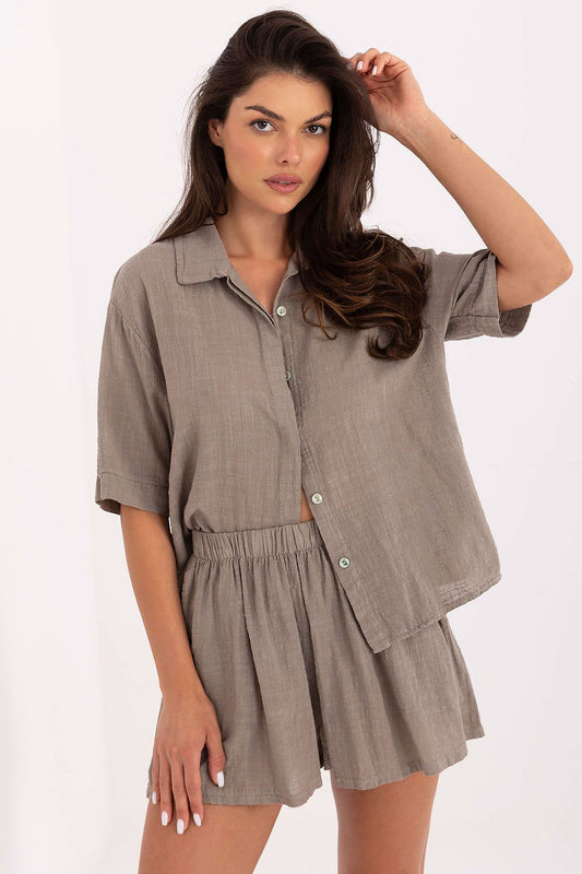 Och Bella luxurious cotton women's summer set featuring a stylish buttoned shirt in a vibrant colour, complemented by high-waisted shorts, perfect for elegant summer outings.