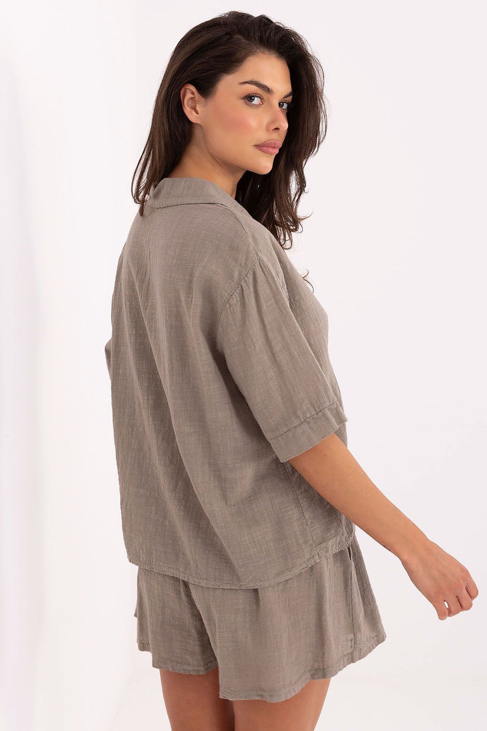 Och Bella cotton high-waisted shorts displaying a chic silhouette and functional side pockets, designed for comfort and style on warm days.