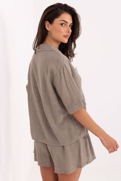 Och Bella cotton high-waisted shorts displaying a chic silhouette and functional side pockets, designed for comfort and style on warm days.