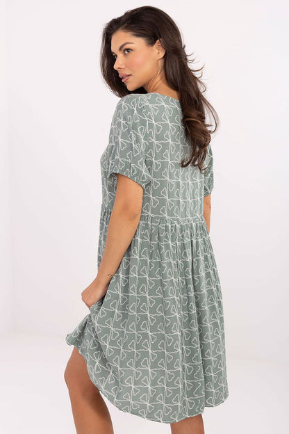 Back view of Summer Flare Dress by Sublevel, highlighting the graceful drape and flared bottom that ensure comfort and elegance.