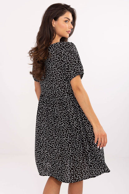 Stylish Sublevel summer flare dress showcasing its flared cut and vivid summer print. Perfect for casual walks and social gatherings, this knee-length dress combines comfort and elegance in soft viscose fabric.