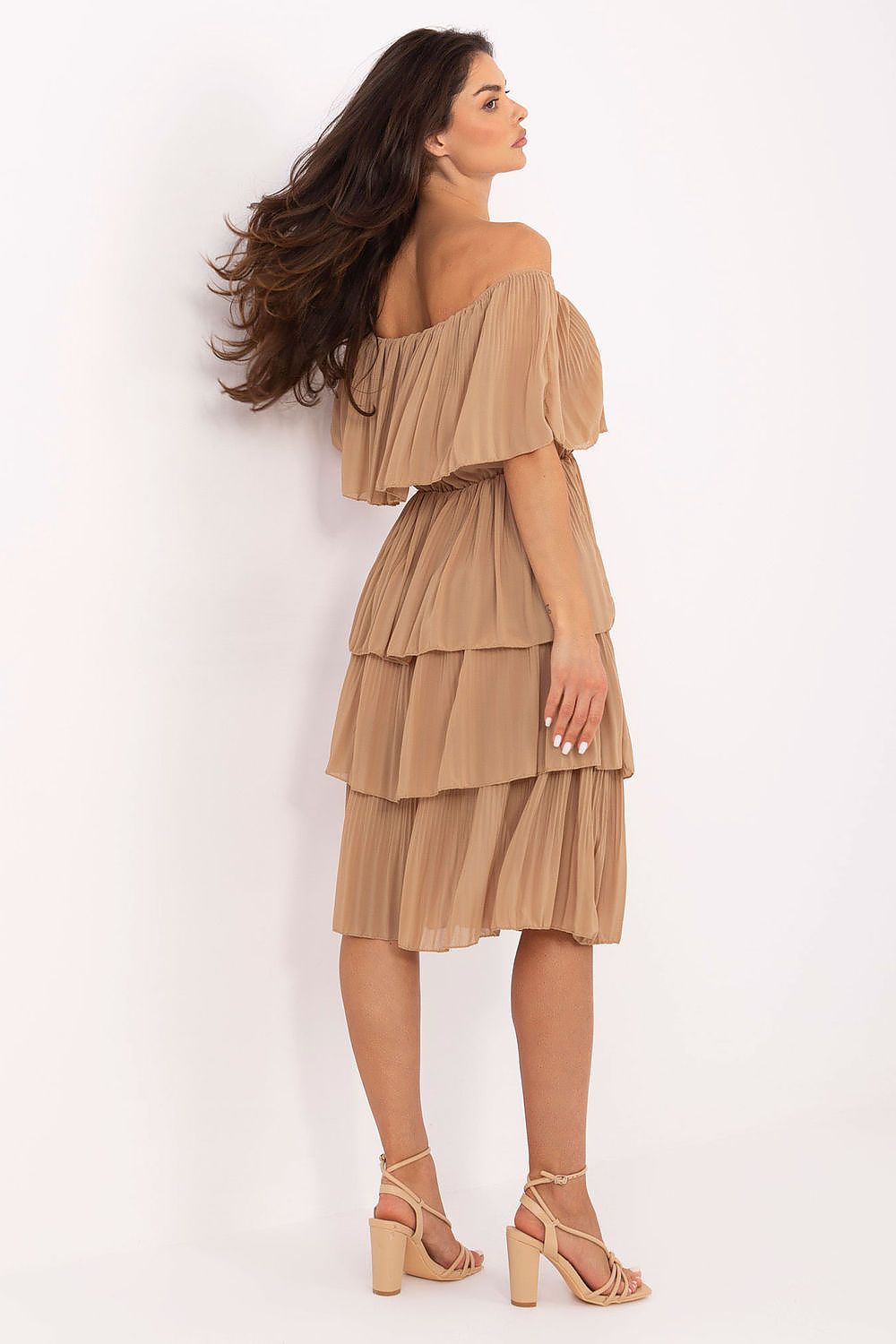 Model wearing the Och Bella off-the-shoulder cocktail dress in a summer setting, illustrating its airy and feminine appeal.