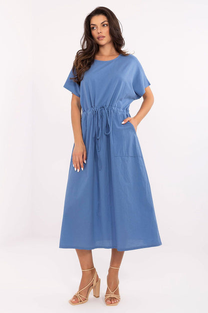 Fashionable woman sharing a joyful moment in Och Bella's luxe midi summer dress, ideal for casual outings and chic social gatherings.