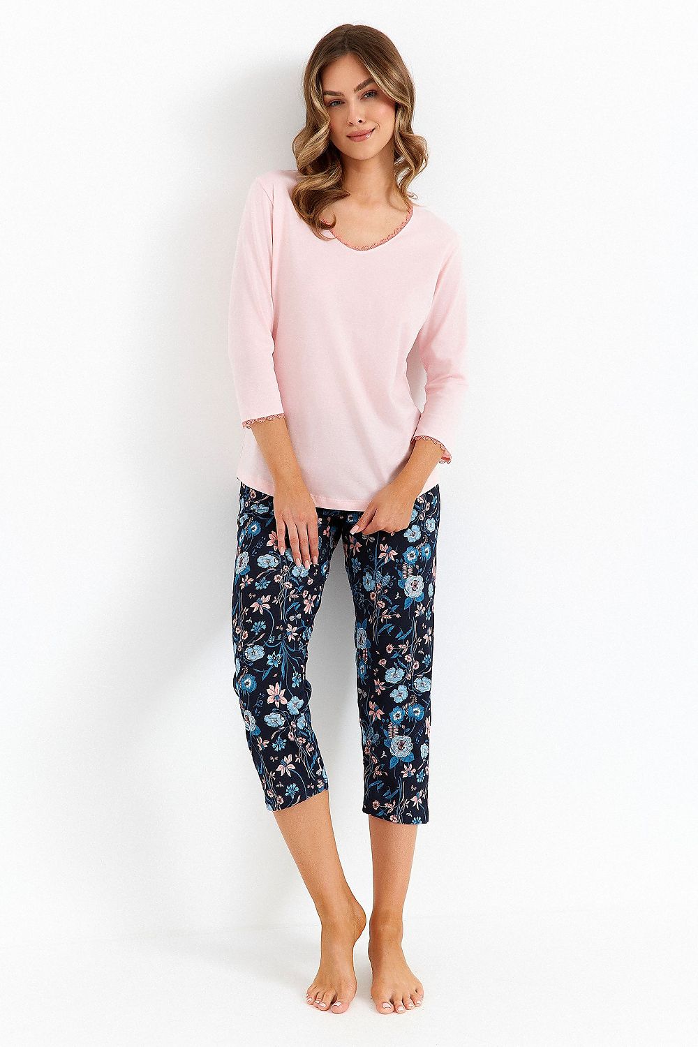 Luxurious women's pyjama set by Cana featuring elegant lace detail, a stylish V-neckline, and trendy print, perfect for comfortable relaxation. Available in sizes S-XXL.