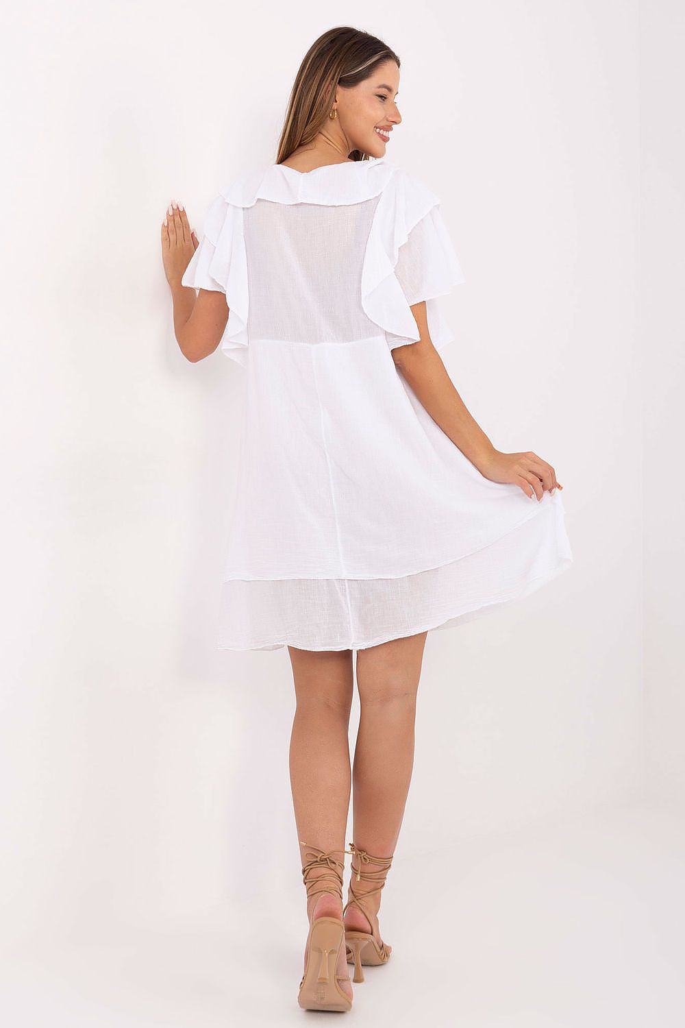 Luxurious knee-length cotton dress with charming ruffles, designed by Italy Moda, perfect for boho style enthusiasts during warm summer days.