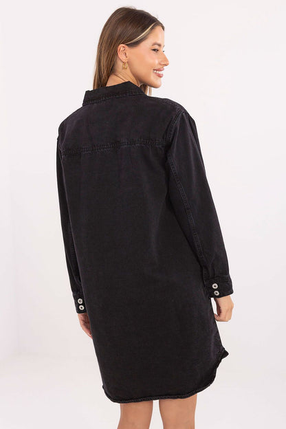 Detail view of Sublevel's Timeless Cotton Denim Daydress showcasing smooth cotton fabric, button-down front, and sophisticated flap pockets.