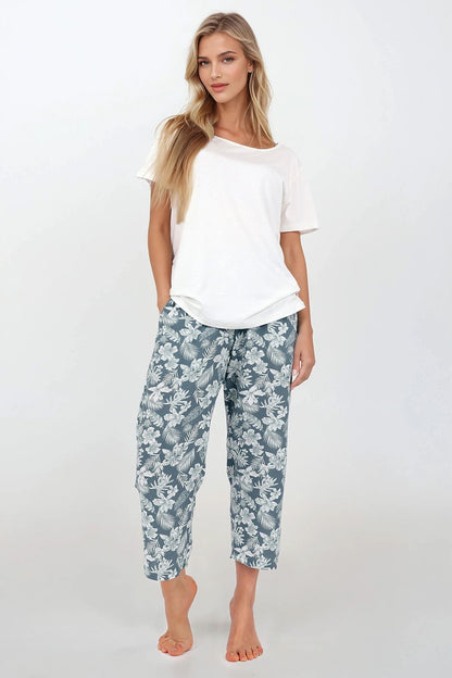 Elegant Women's Two-Piece Pajamas Set by Momenti Per Me, crafted from soft viscose fabric, showcasing a loose fit with short sleeves and oversized straight-leg pants, perfect for luxury nightwear or home relaxation.