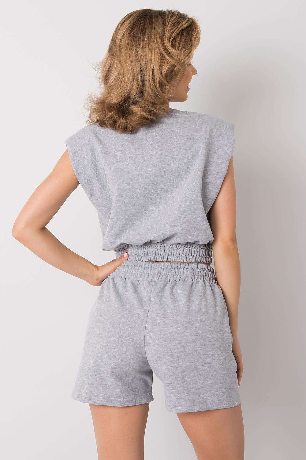 Sophisticated Rue Paris women's activewear set, comprising a sleek sweatshirt and tailored shorts, perfect for warm weather styling.