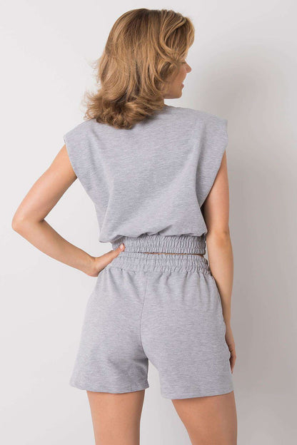 Sophisticated Rue Paris women's activewear set, comprising a sleek sweatshirt and tailored shorts, perfect for warm weather styling.