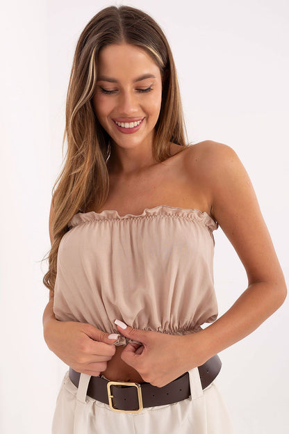 Elegant minimalist sleeveless crop top by Lakerta, crafted from soft viscose, perfect for stylish summer outfits. Available in sizes EU S/M and L/XL, this chic design features a flattering rectangular neckline and a delicate ruffle hem, ideal for accentuating the waist.